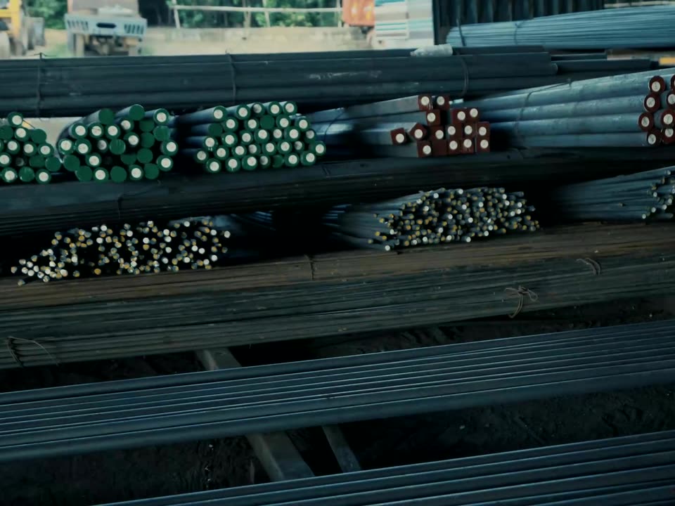 Colour-coded alloy steel bar bundles ready for dispatch